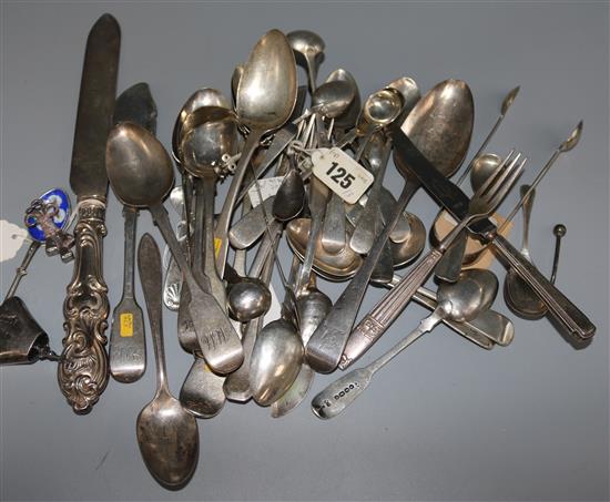 Thirty three items of assorted silver flatware including two pairs of sugar tongs and eleven other plated items, 27 oz.